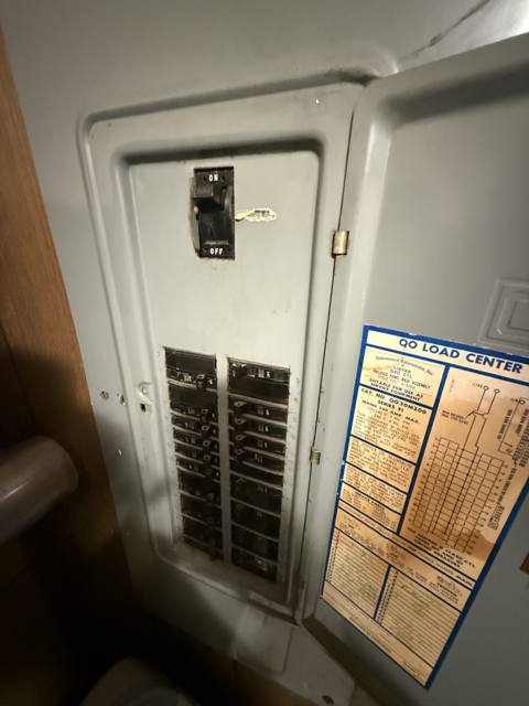 Before: electrical panel with the door open