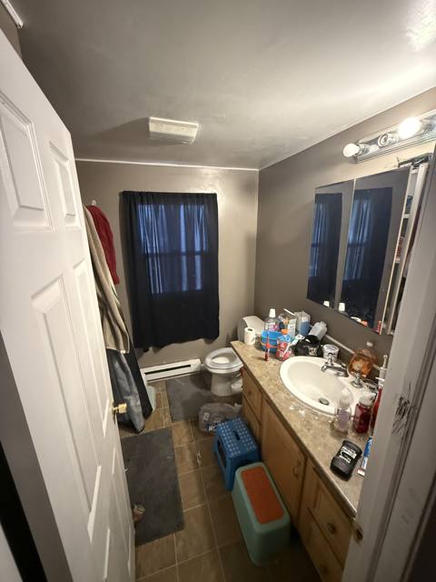 Before: bathroom vanity and window