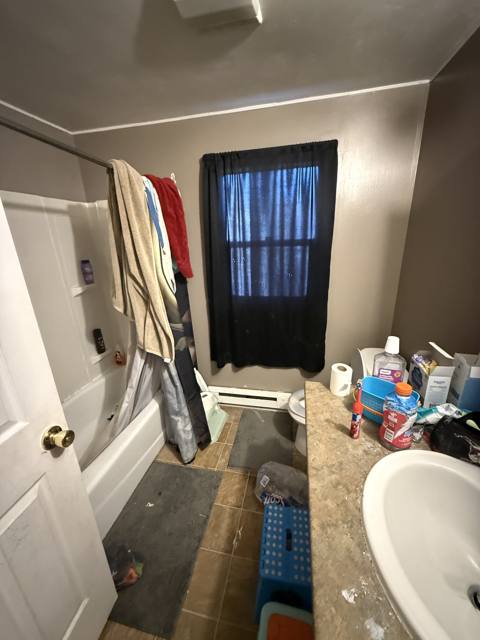 Before: bathroom tub and sink