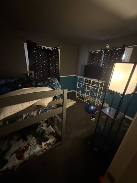 Before: bedroom with a bunk bed, tall view