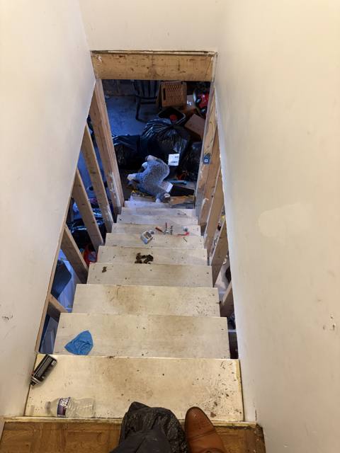 Before: stairs down to the lower level from the top