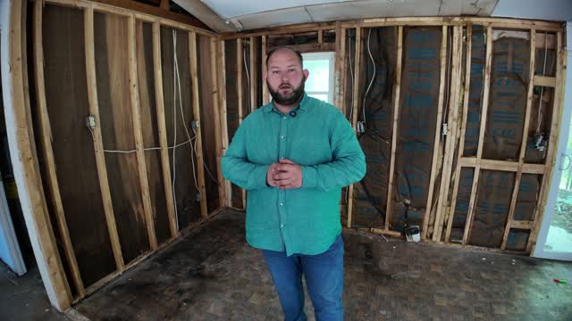 June 3: Kamil in the gutted front room of 19 Oak St